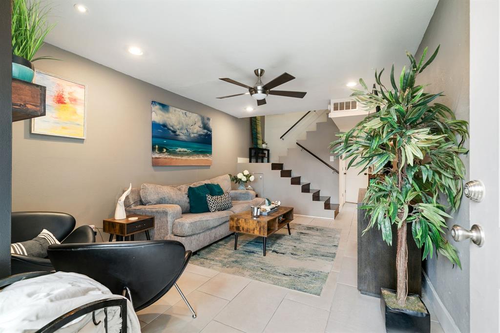 4347 Dickason Avenue, Unit 111 Dallas, TX 75219 - Photo 9 of 37 a living room with furniture a potted plant and a ceiling fan