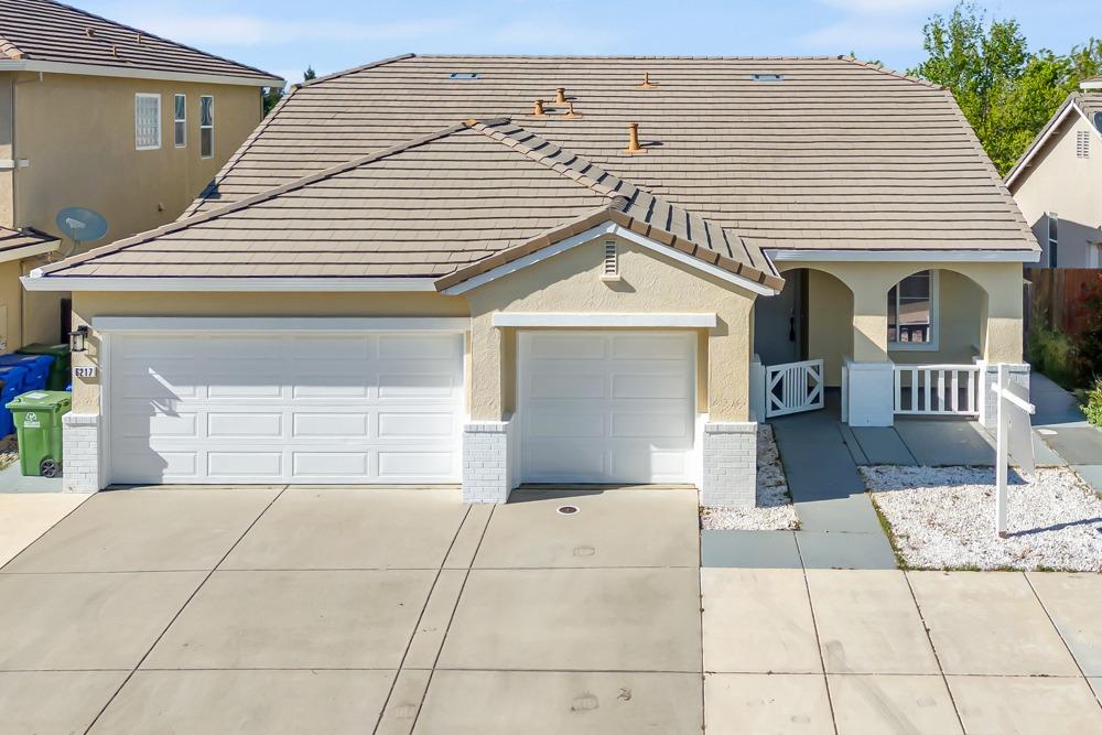6217 Jefjen Way Elk Grove, CA 95757 - Photo 1 of 41 a front view of a house with a garage