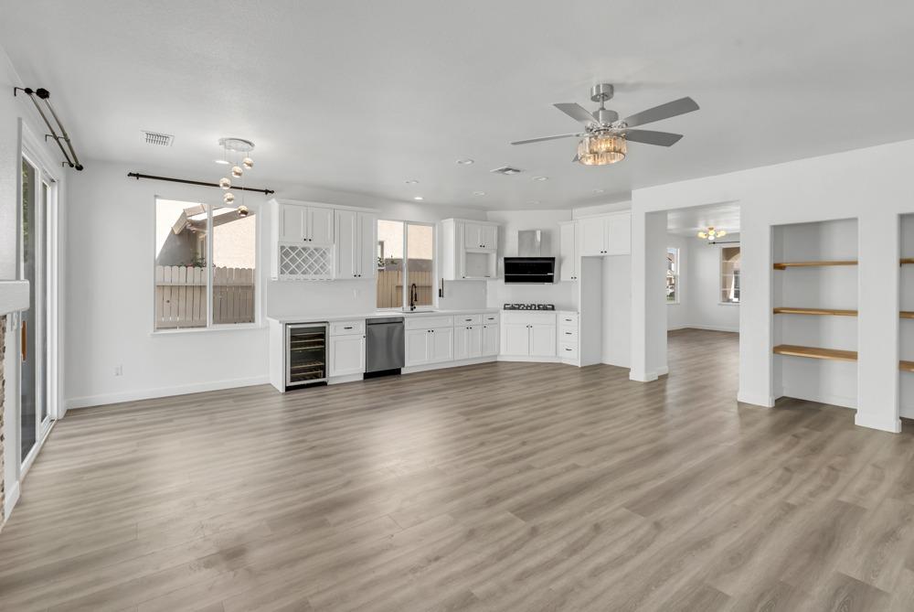 6217 Jefjen Way Elk Grove, CA 95757 - Photo 14 of 41 a view of a kitchen with a fridge wooden floor and a window