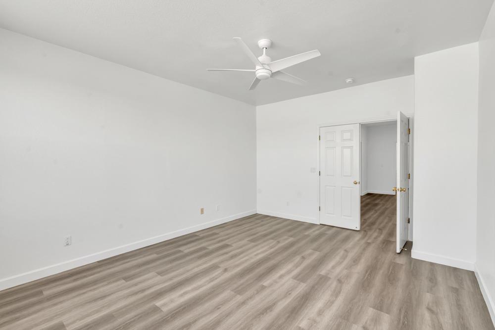 6217 Jefjen Way Elk Grove, CA 95757 - Photo 15 of 41 a view of an empty room with wooden floor