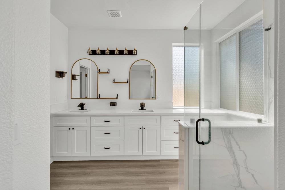 6217 Jefjen Way Elk Grove, CA 95757 - Photo 20 of 41 a bathroom with a double vanity sink mirror and window