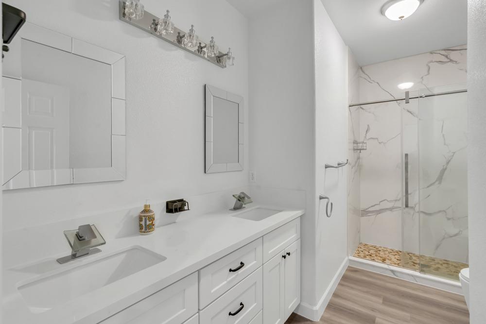6217 Jefjen Way Elk Grove, CA 95757 - Photo 27 of 41 a bathroom with a sink and a mirror