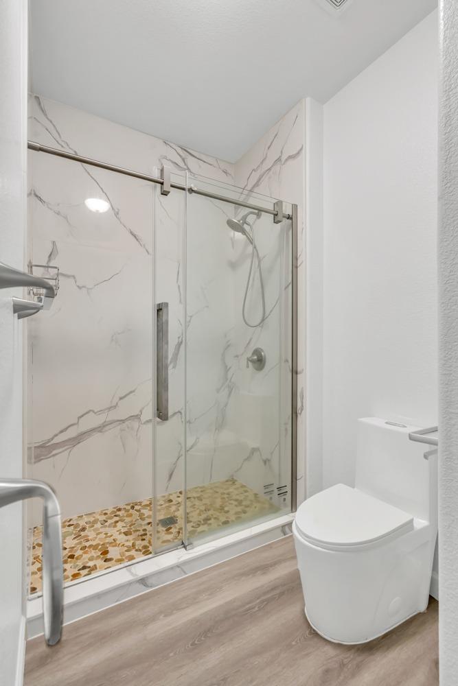 6217 Jefjen Way Elk Grove, CA 95757 - Photo 28 of 41 a bathroom with a shower and a toilet