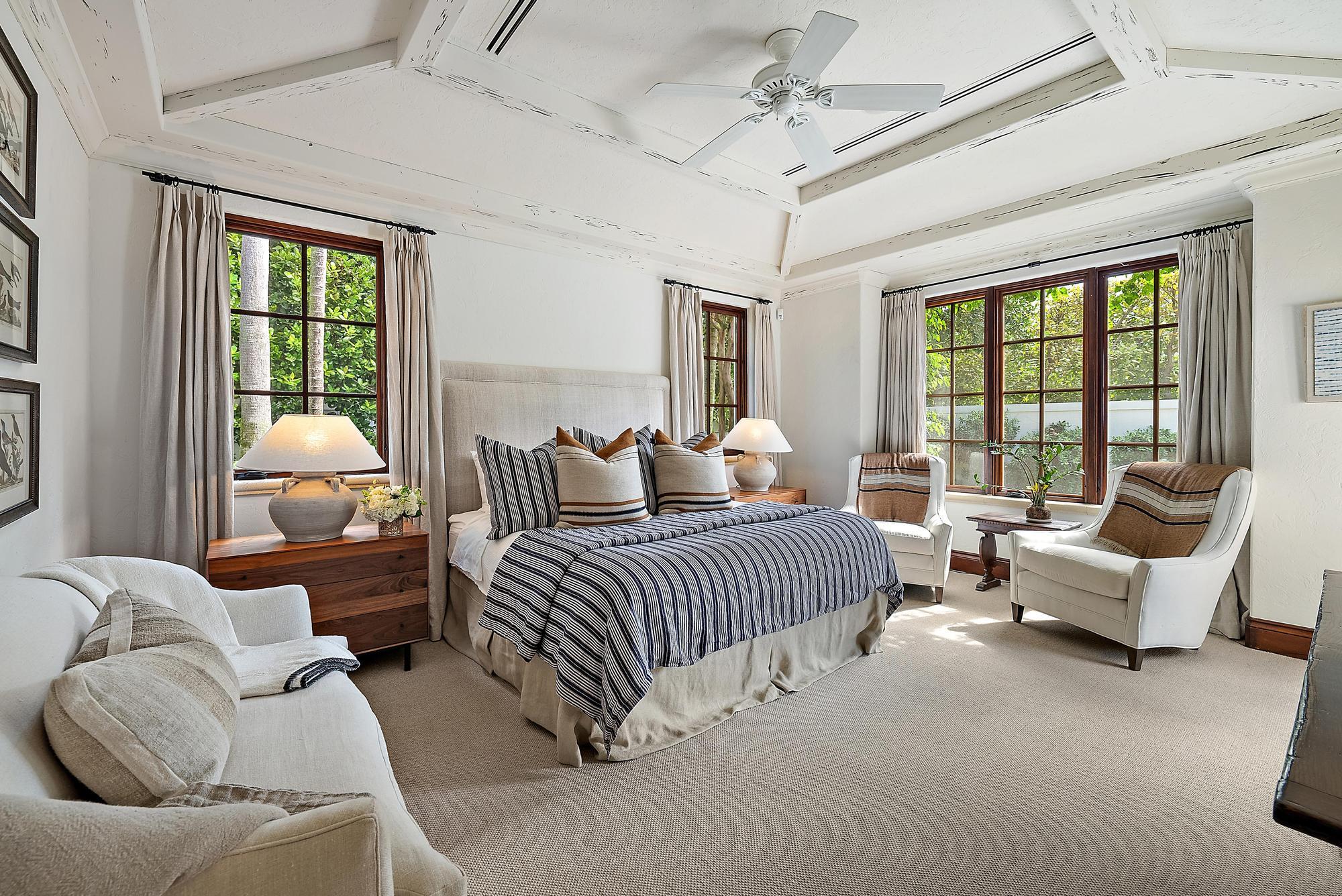 234 Ridgeview Drive Palm Beach, FL 33480 - Photo 12 of 20 a bedroom with furniture and large windows