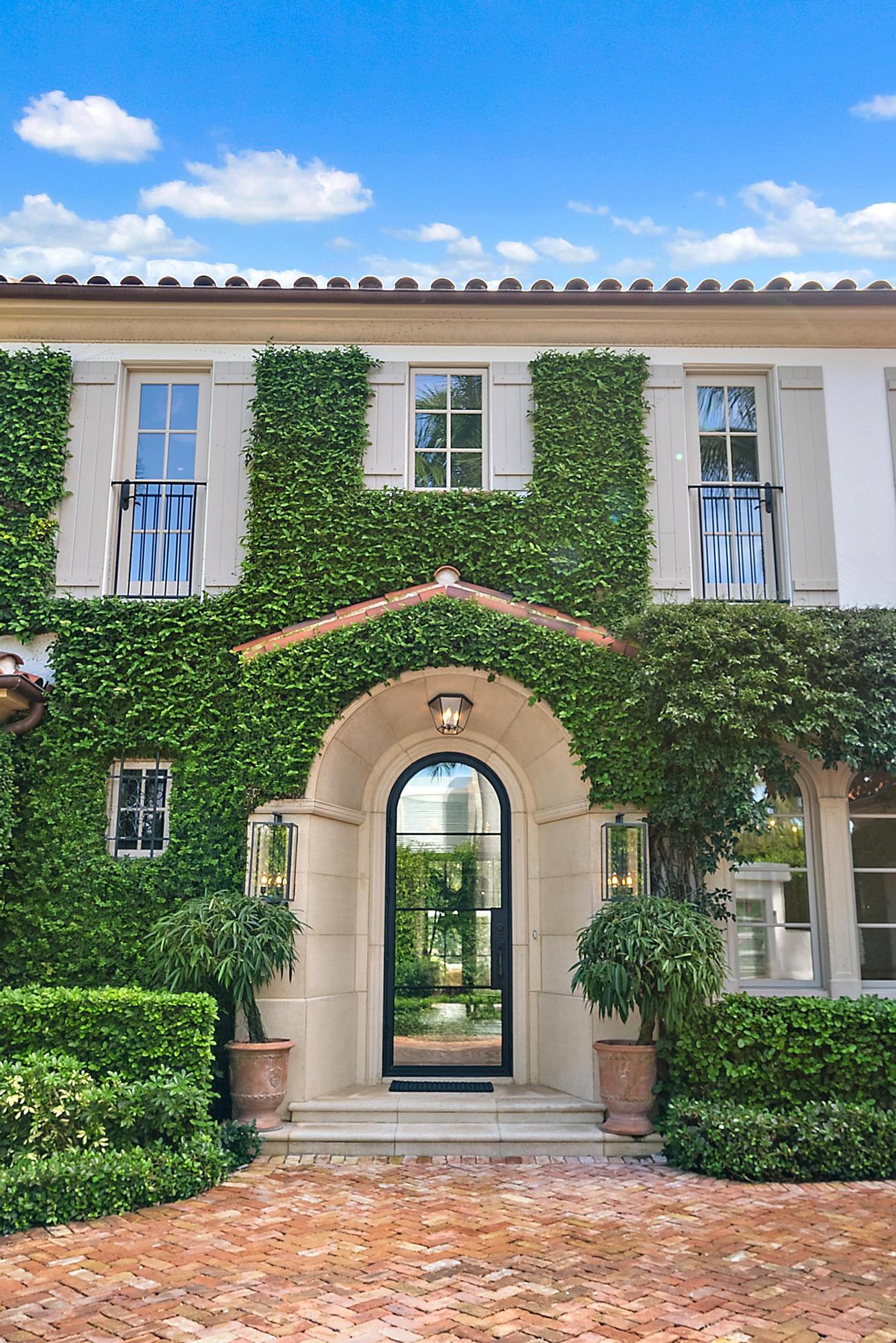 234 Ridgeview Drive Palm Beach, FL 33480 - Photo 17 of 20 a front view of a house with garden