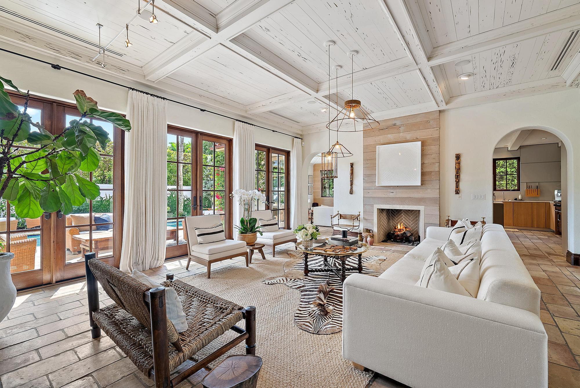 234 Ridgeview Drive Palm Beach, FL 33480 - Photo 2 of 20 a living room with furniture a fireplace and a potted plant