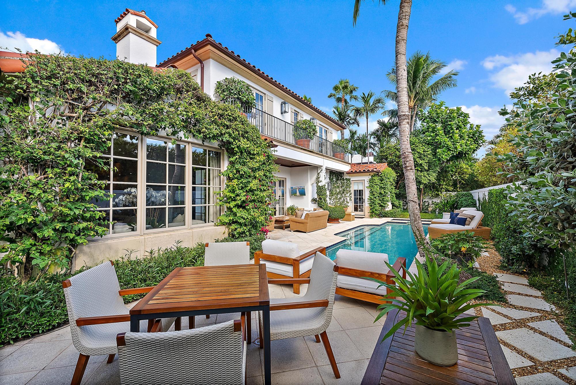 234 Ridgeview Drive Palm Beach, FL 33480 - Photo 5 of 20 a view of a house with a chairs and table in a patio