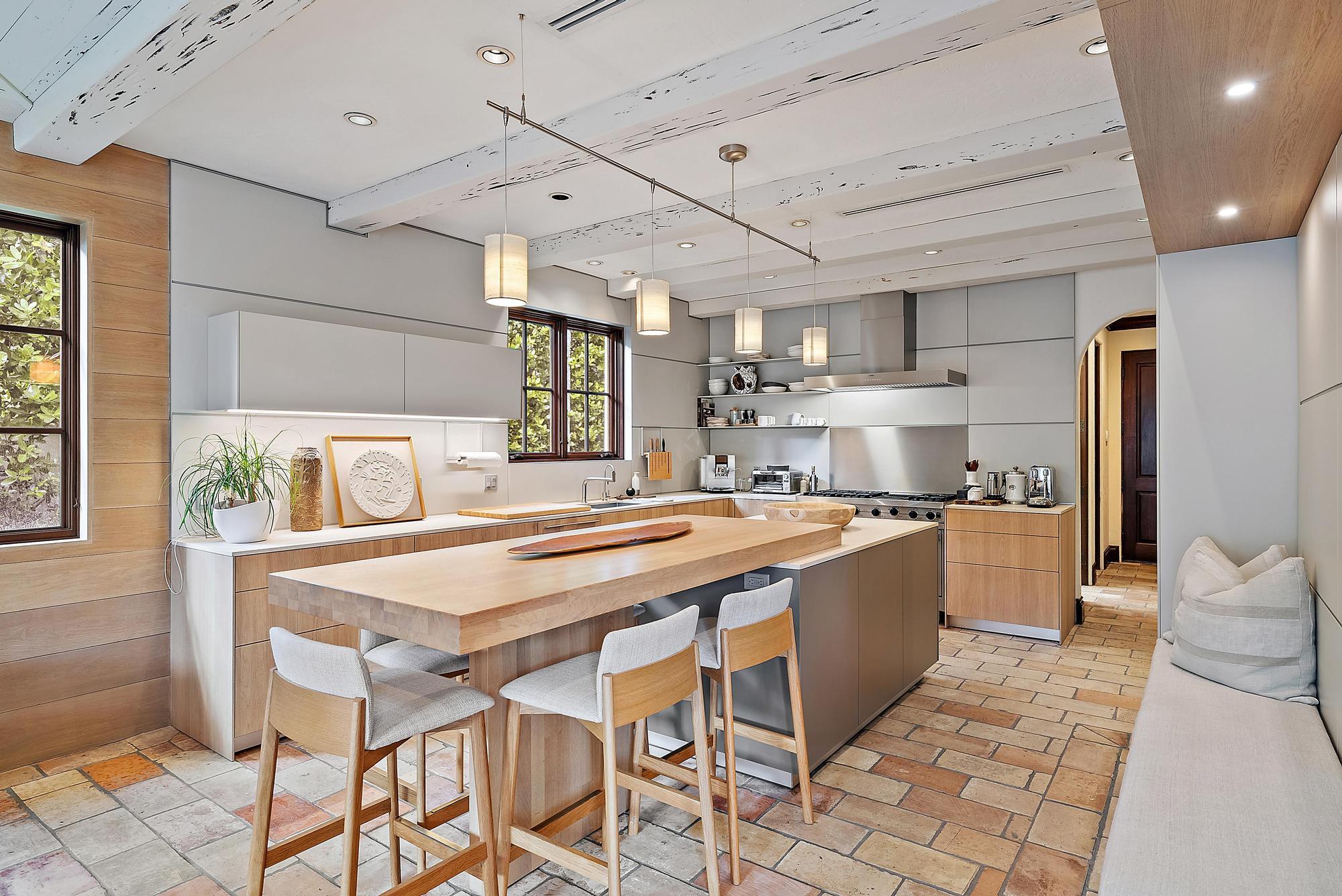 234 Ridgeview Drive Palm Beach, FL 33480 - Photo 9 of 20 a large kitchen with kitchen island a stove a sink dishwasher and a refrigerator