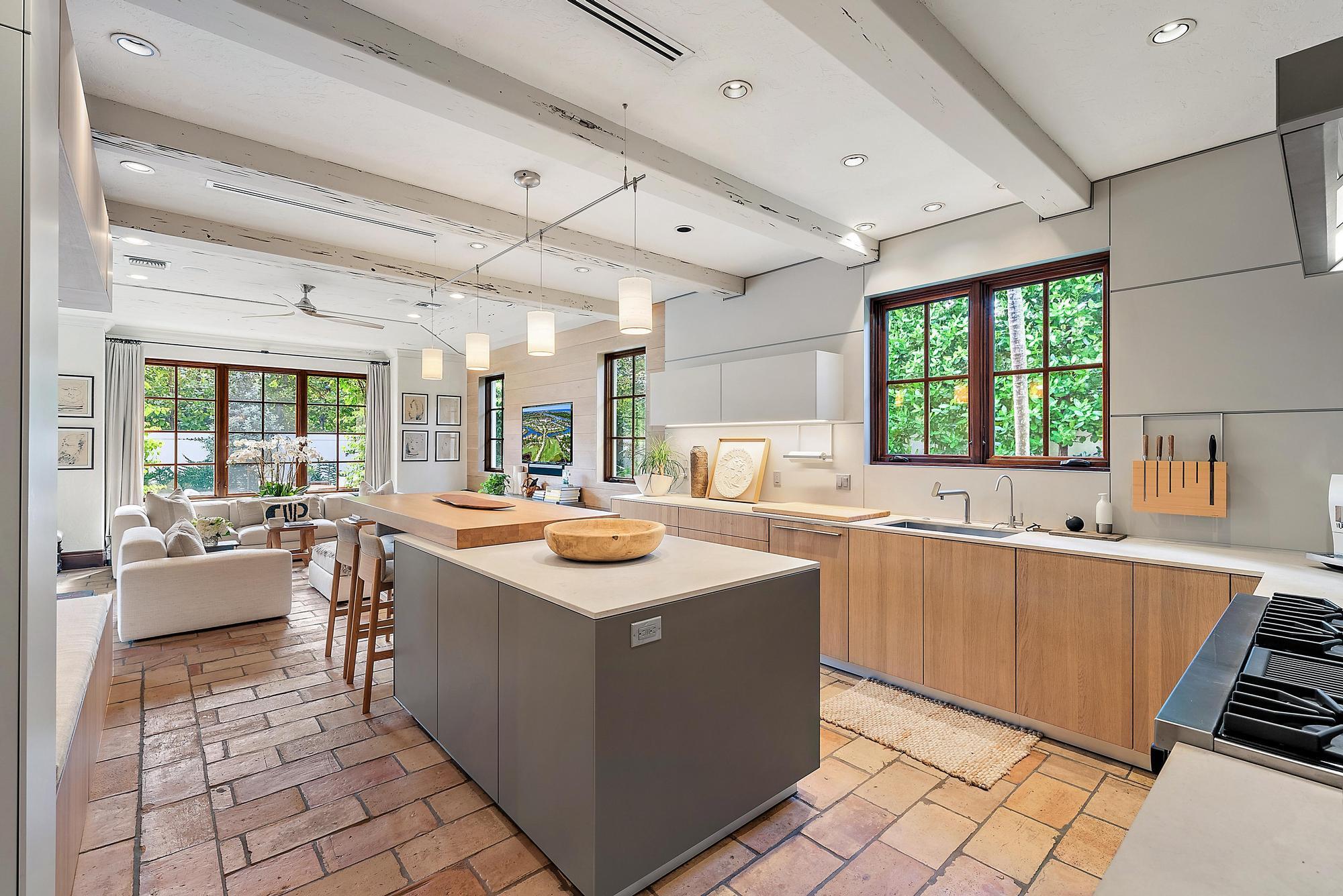 234 Ridgeview Drive Palm Beach, FL 33480 - Photo 10 of 20 a kitchen with stainless steel appliances a sink stove and cabinets