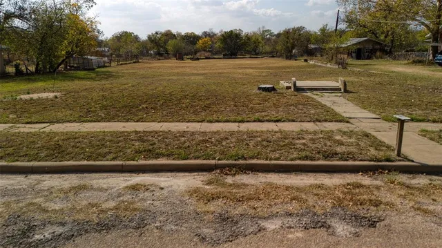 a view of a yard with an ocean