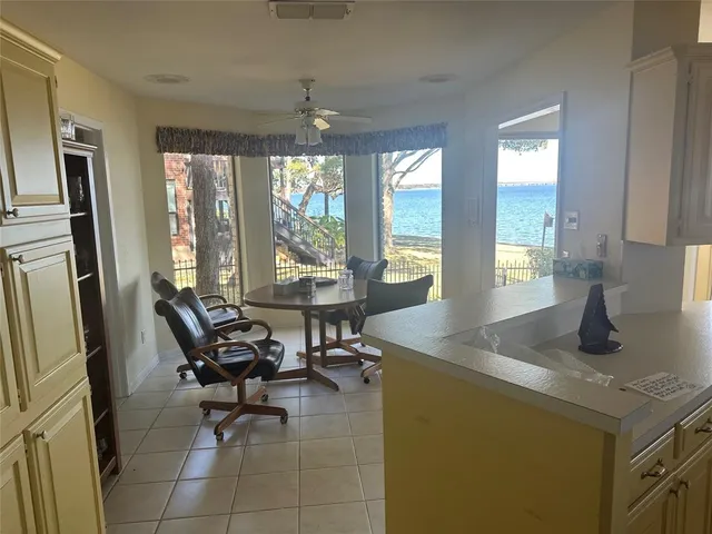 a dining room with furniture and a chandelier