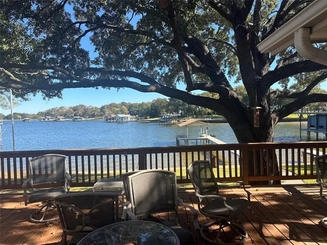 a view of a chair and table on the deck