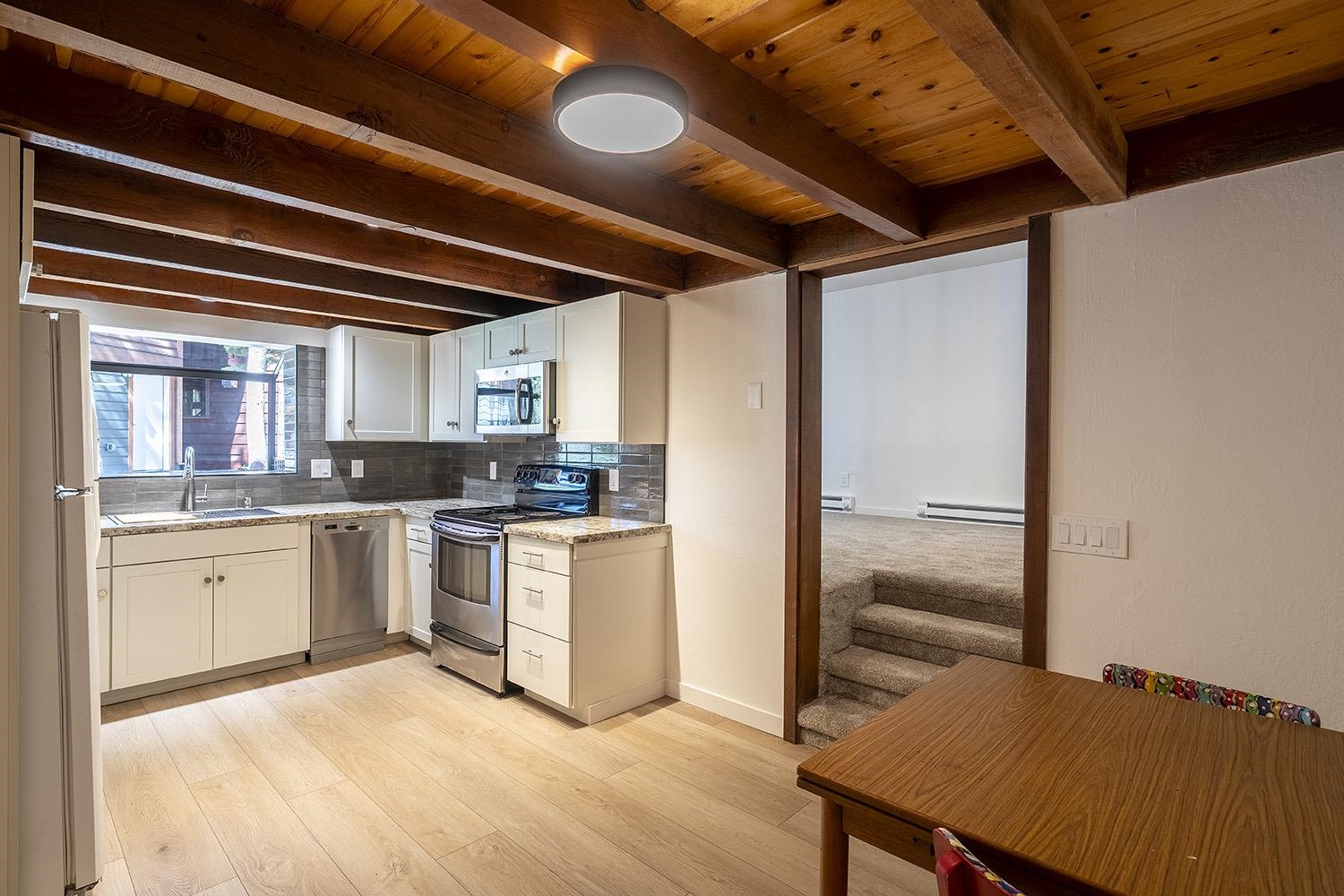 390 Forest Glen Road Olympic Valley, CA 96146 - Photo 19 of 25 a kitchen with sink and refrigerator
