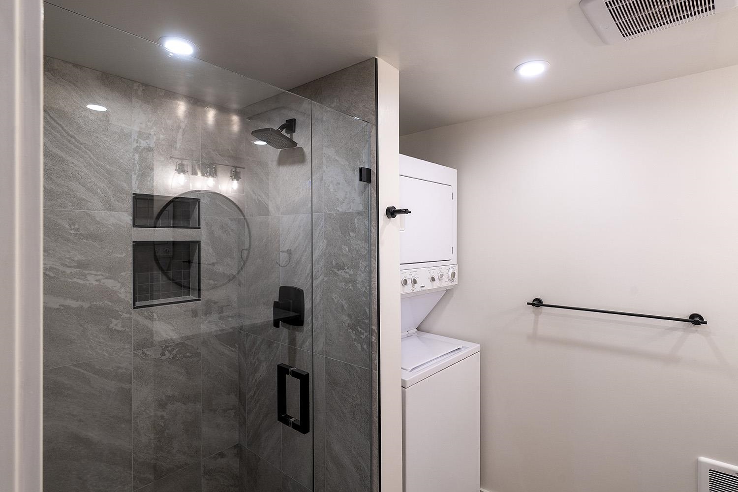 390 Forest Glen Road Olympic Valley, CA 96146 - Photo 20 of 25 a bathroom with a shower and a mirror