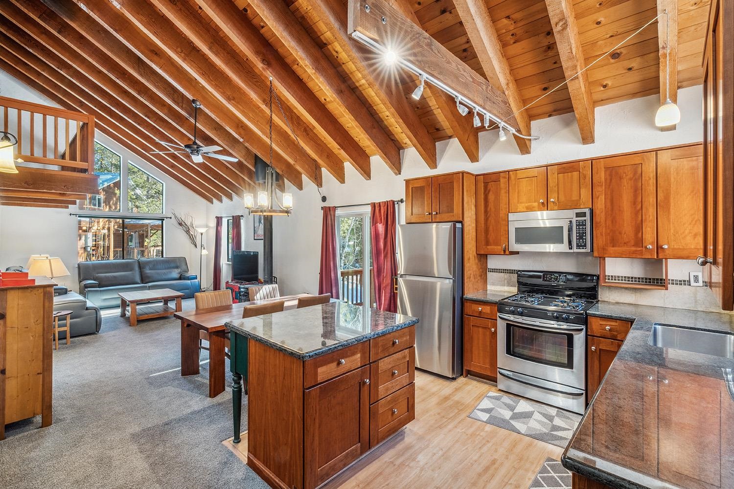390 Forest Glen Road Olympic Valley, CA 96146 - Photo 7 of 25 a kitchen with stainless steel appliances granite countertop a stove and refrigerator