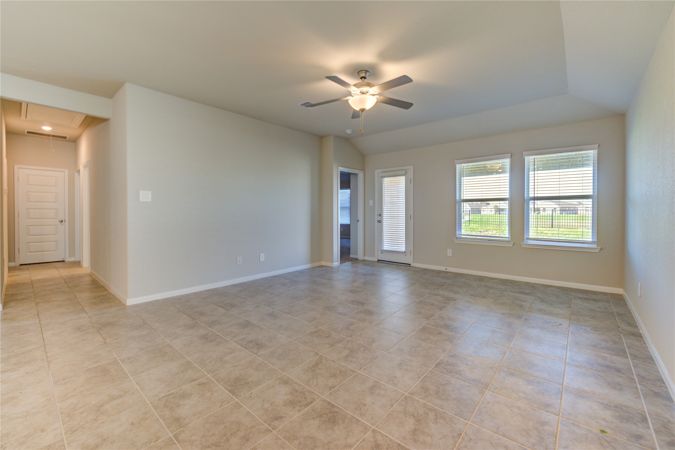 1207 Cascade Hls Drive Rosharon, TX 77583 - Photo 26 of 41 an empty room with windows and chandelier fan