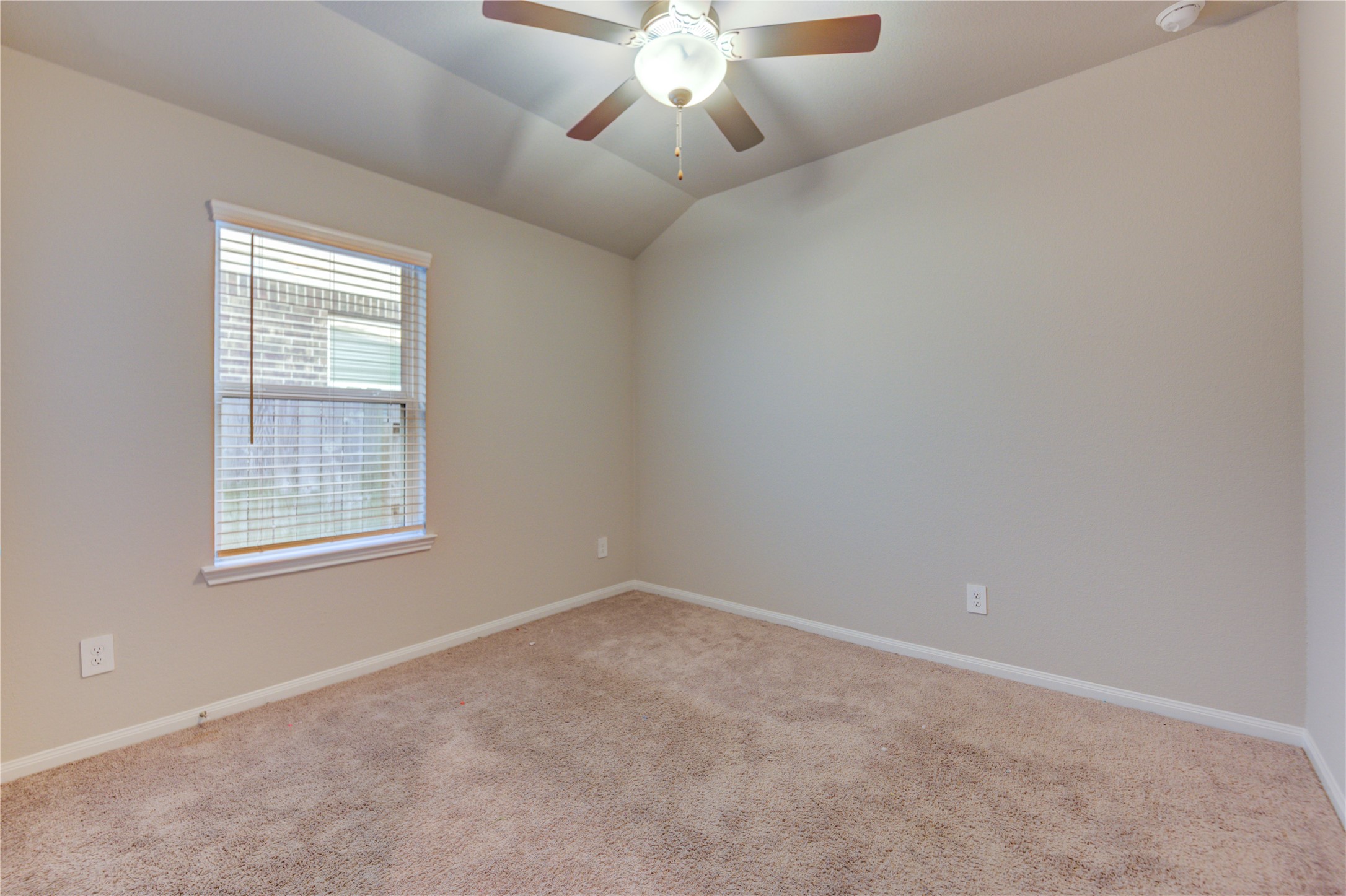 1207 Cascade Hls Drive Rosharon, TX 77583 - Photo 32 of 41 an empty room with chandelier fan and windows