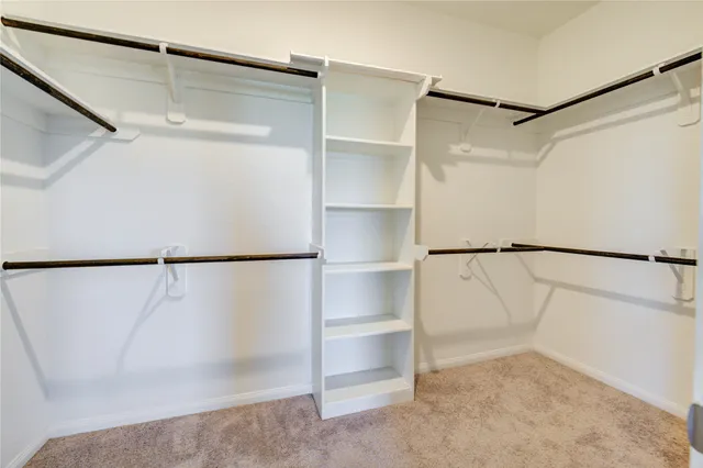 a white bath tub sitting next to a shower