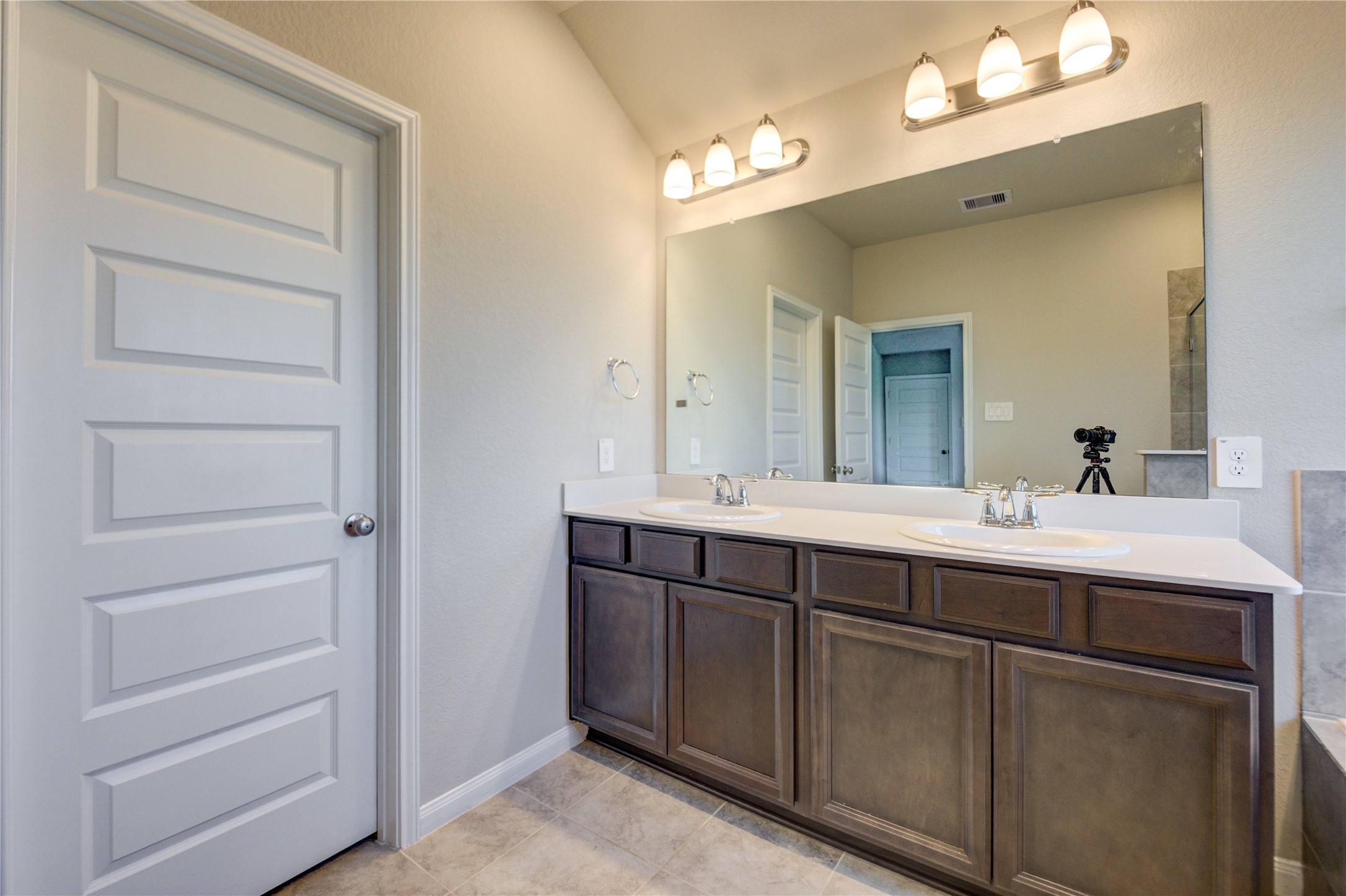 1207 Cascade Hls Drive Rosharon, TX 77583 - Photo 41 of 41 a bathroom with a double vanity sink and mirror