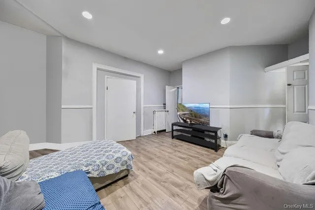 a bedroom with a bed and a couch