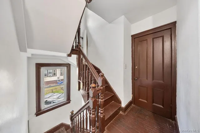 a view of an entryway with wooden floor