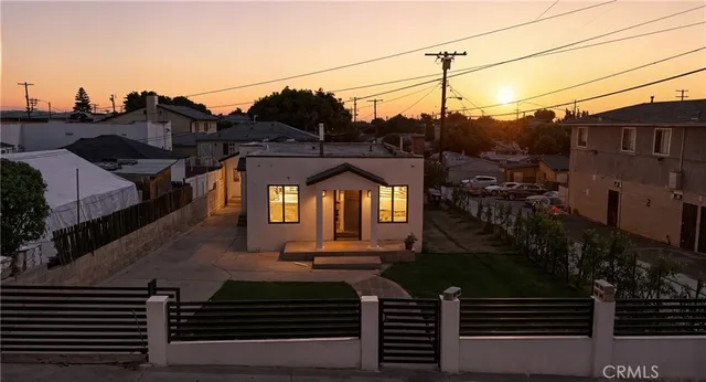 a view of a house with a street