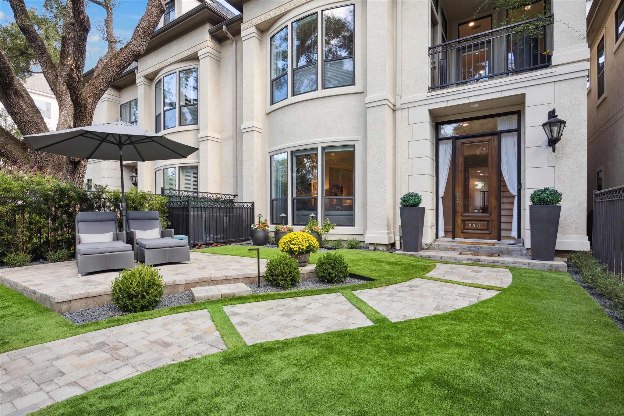 2911 Mid Lane Houston, TX 77027 - Photo 1 of 31 a view of a chair and table in backyard of the house