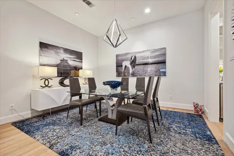 a view of dining room and wooden floor