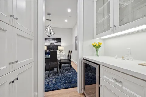 a view of kitchen island with furniture and wooden floor