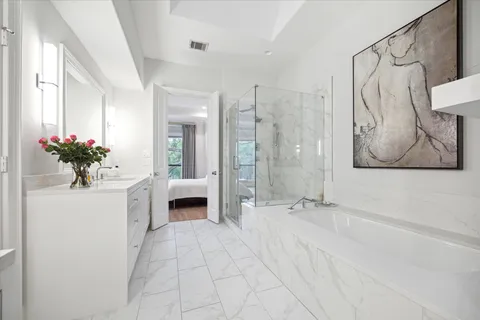 a view of bathroom with a tub shower and mirror