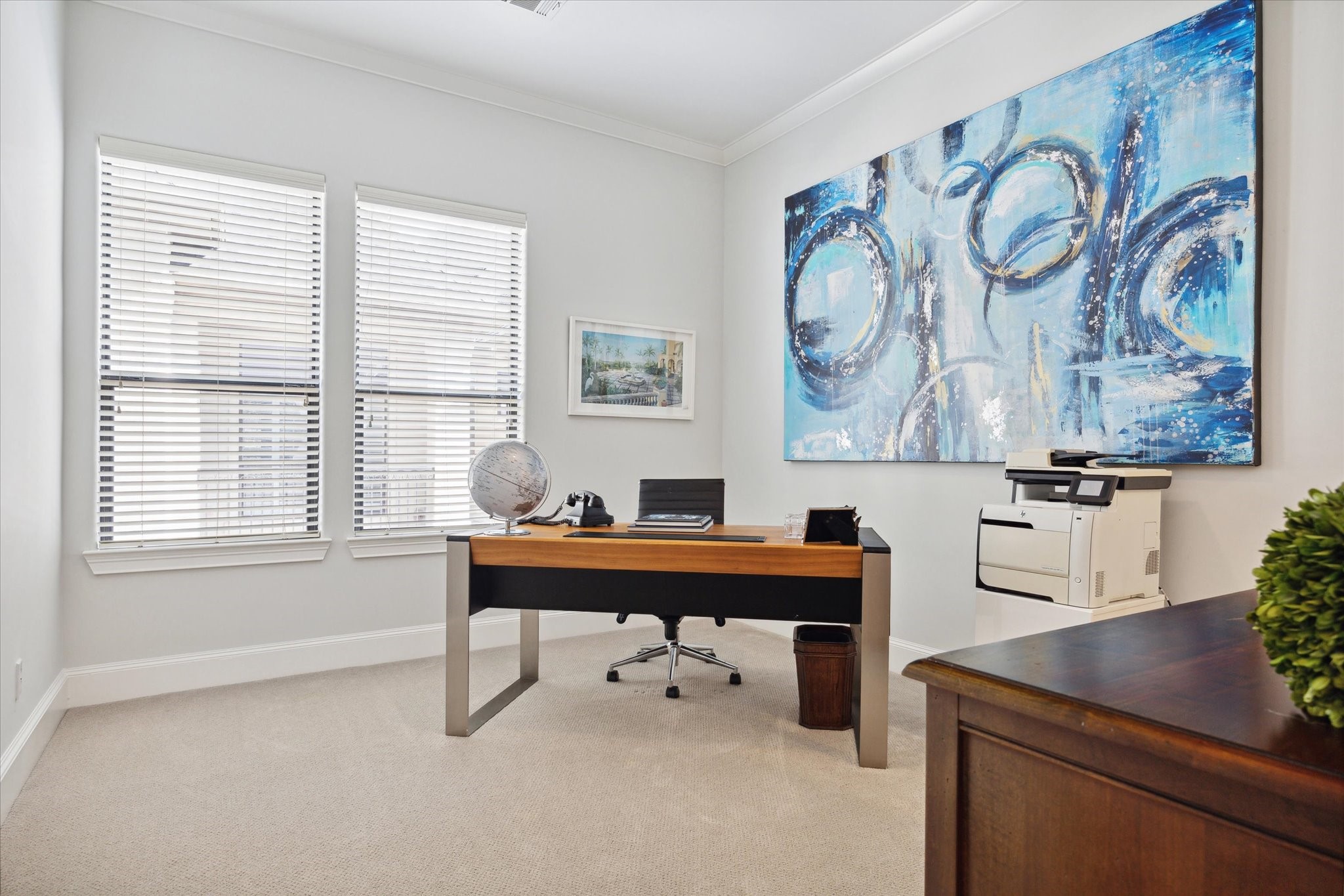 2911 Mid Lane Houston, TX 77027 - Photo 25 of 31 a workspace with furniture and paintings on the wall