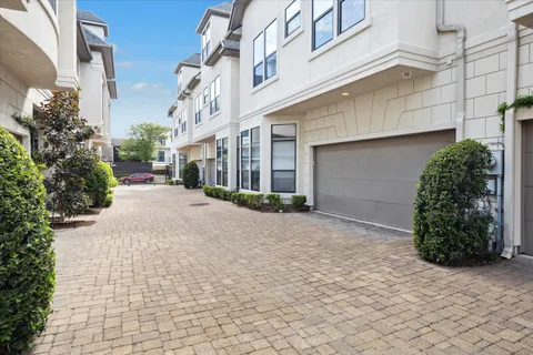 a view of a street with a building in the background