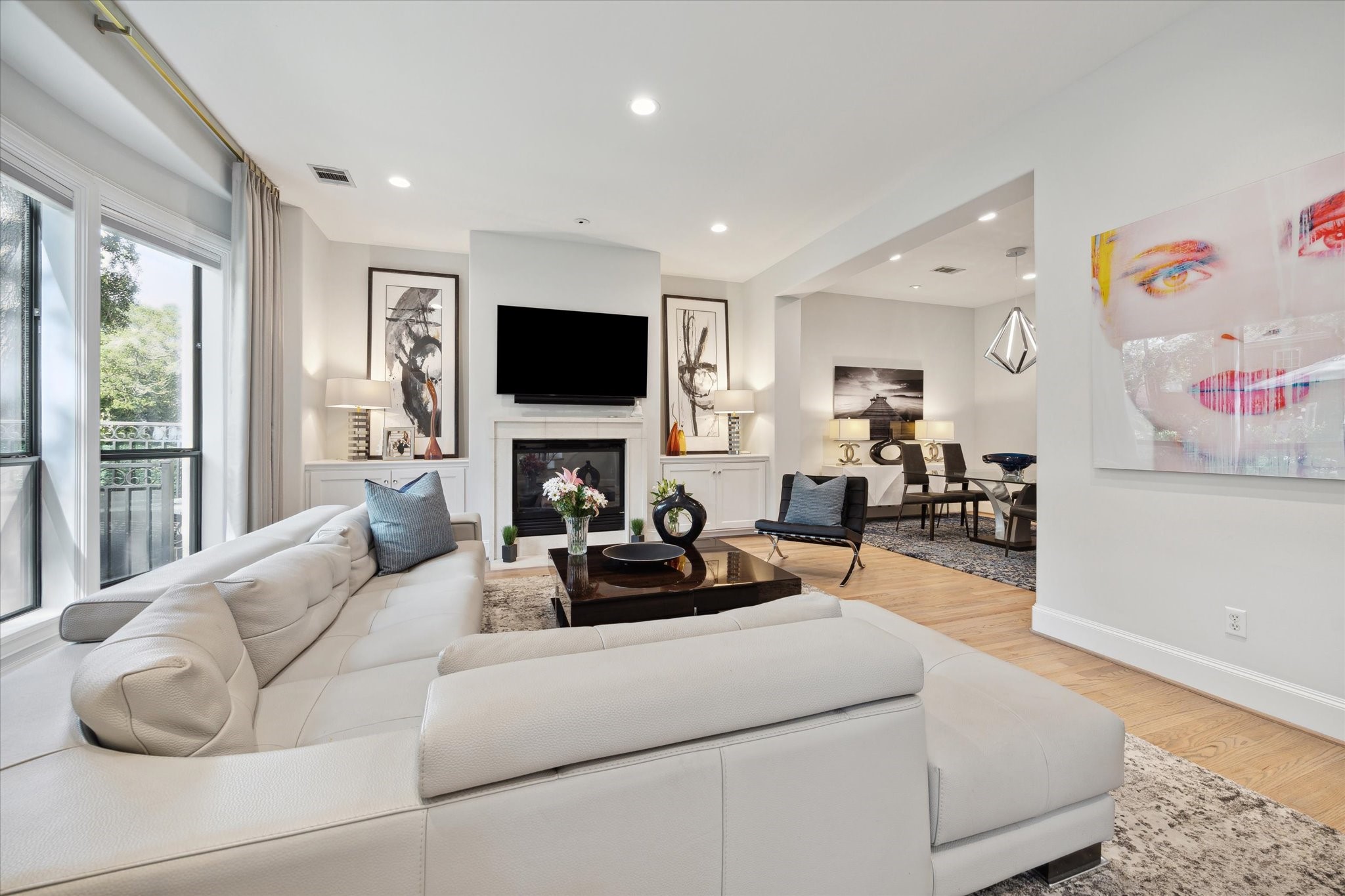 2911 Mid Lane Houston, TX 77027 - Photo 6 of 31 a living room with furniture a fireplace and a flat screen tv