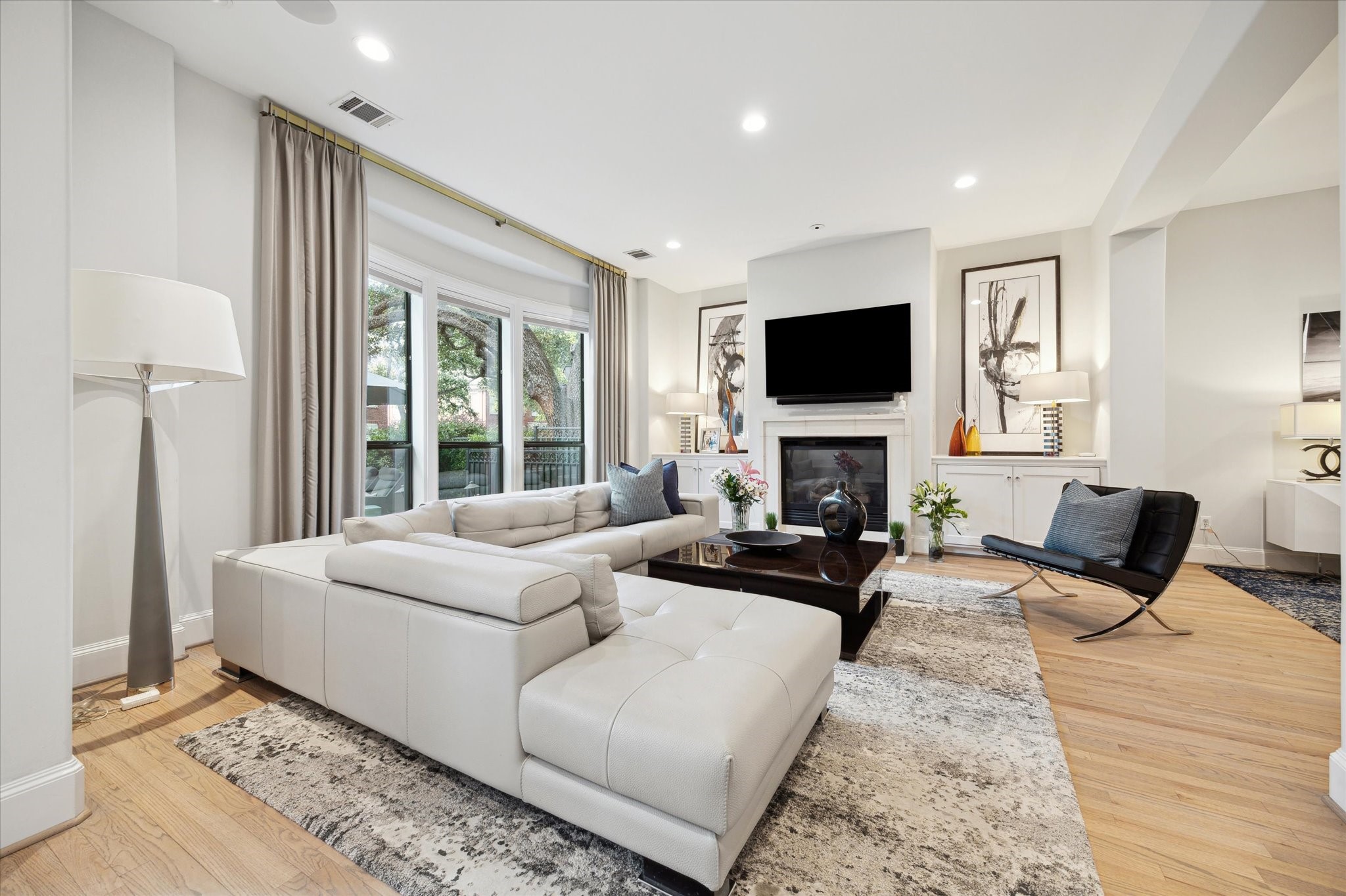 2911 Mid Lane Houston, TX 77027 - Photo 7 of 31 a living room with fireplace furniture and a flat screen tv