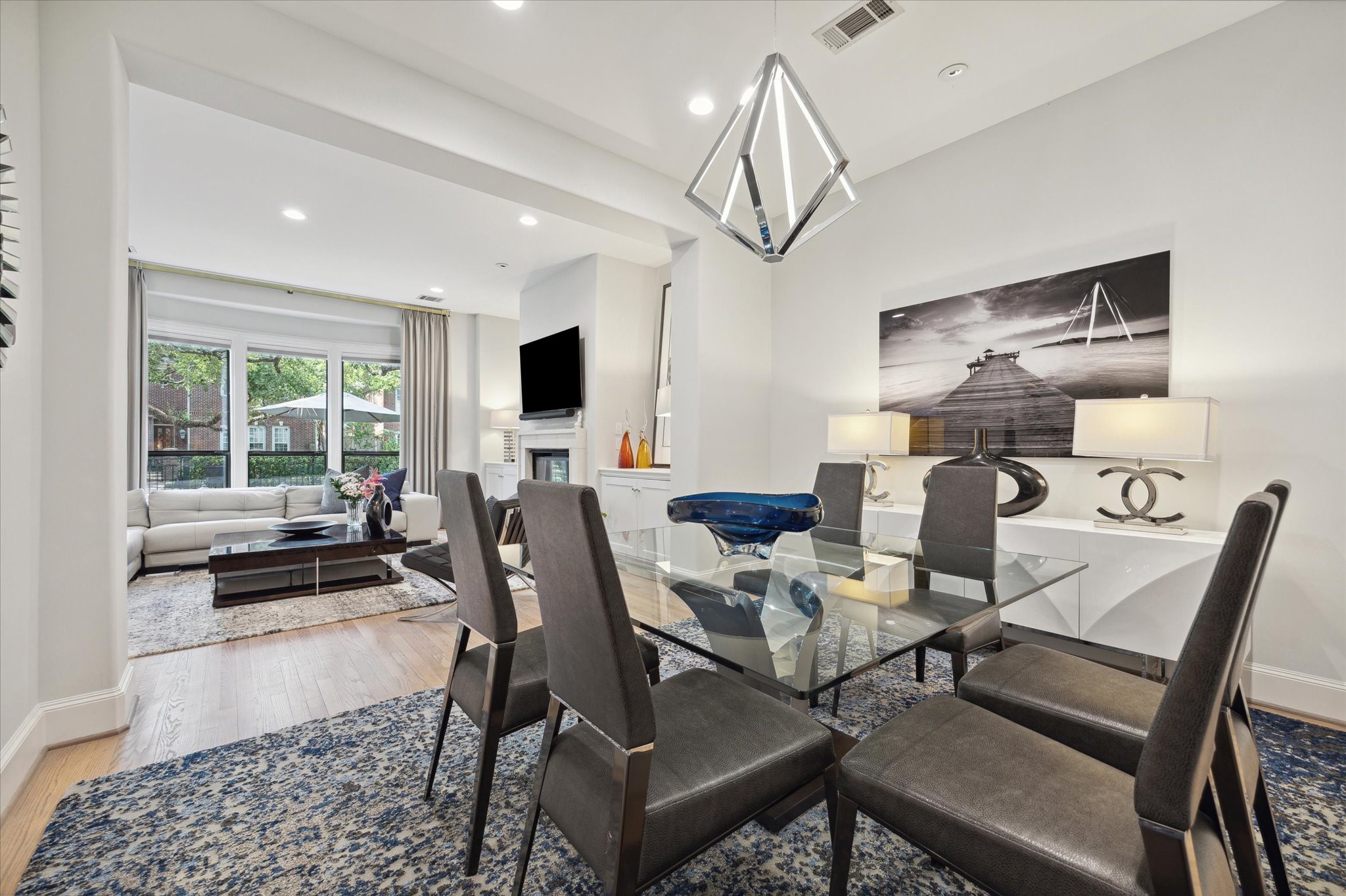 2911 Mid Lane Houston, TX 77027 - Photo 10 of 31 a view of a dining room with furniture window and wooden floor