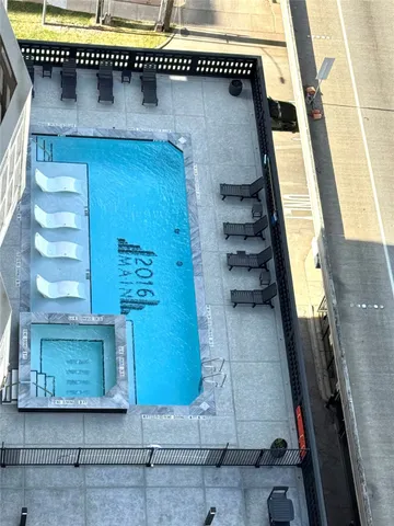 a view of work space with furniture and windows