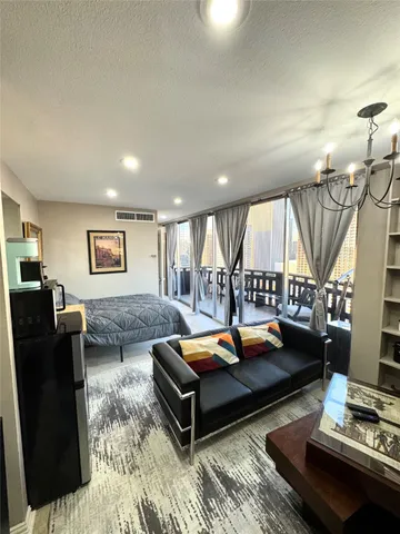 a living room with furniture and a table