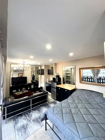 a living room with furniture a rug and a fireplace