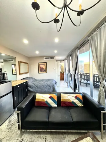 a view of a living room and dining room