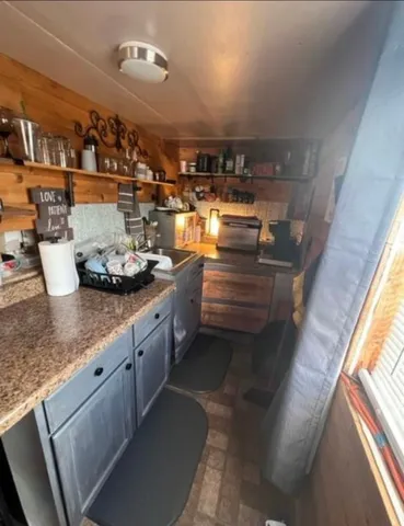 a kitchen with counter top space and stainless steel appliances