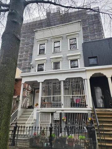 a view of a brick building with many windows