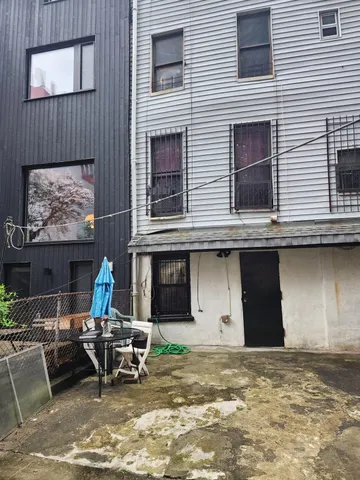 a view of a two chairs in the patio