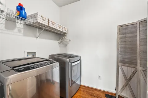 a en suite bathroom with a granite countertop sink and a mirror