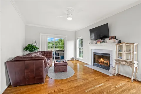 a white bath tub sitting in a bathroom next to a window