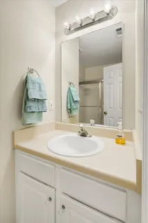 a view of a roof deck with table and chairs with wooden floor and fence