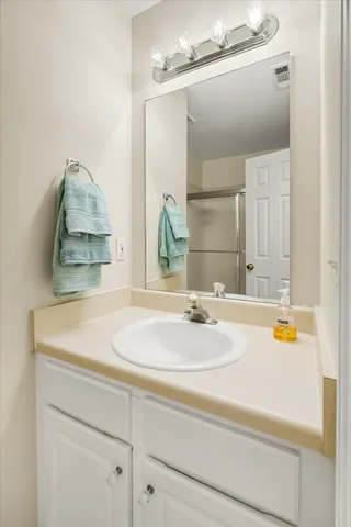 a view of a roof deck with table and chairs with wooden floor and fence