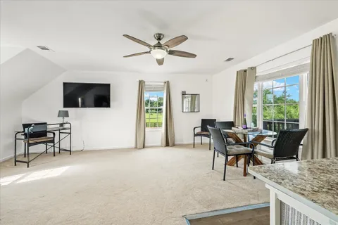 a view of a deck with table and chairs and wooden floor