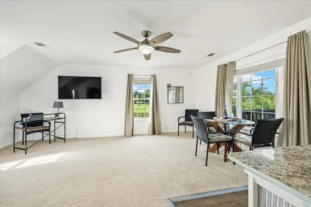 a view of a deck with table and chairs and wooden floor