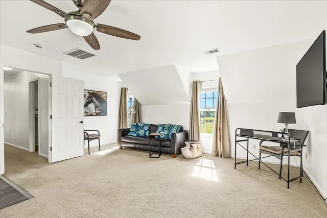 a view of a deck with wooden floor and outdoor seating