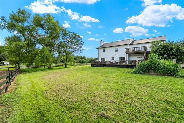 an aerial view of house with yard